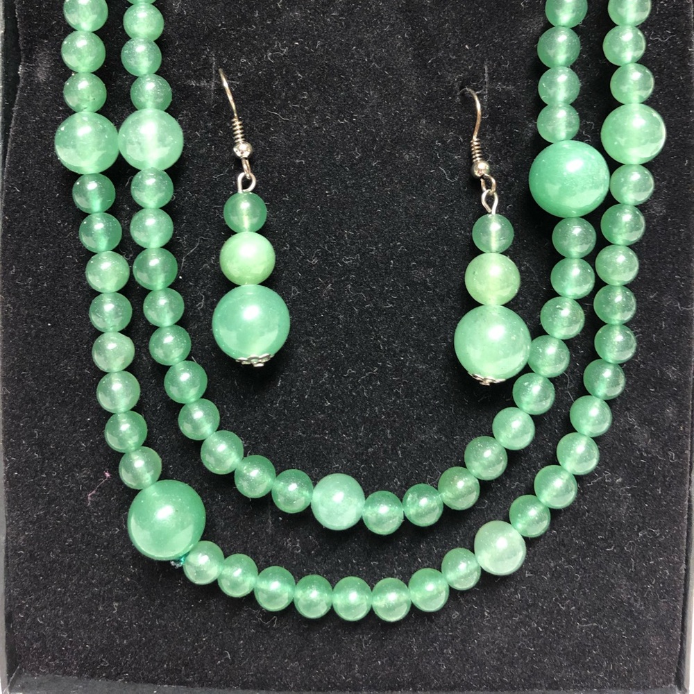 Green necklace and earrings.